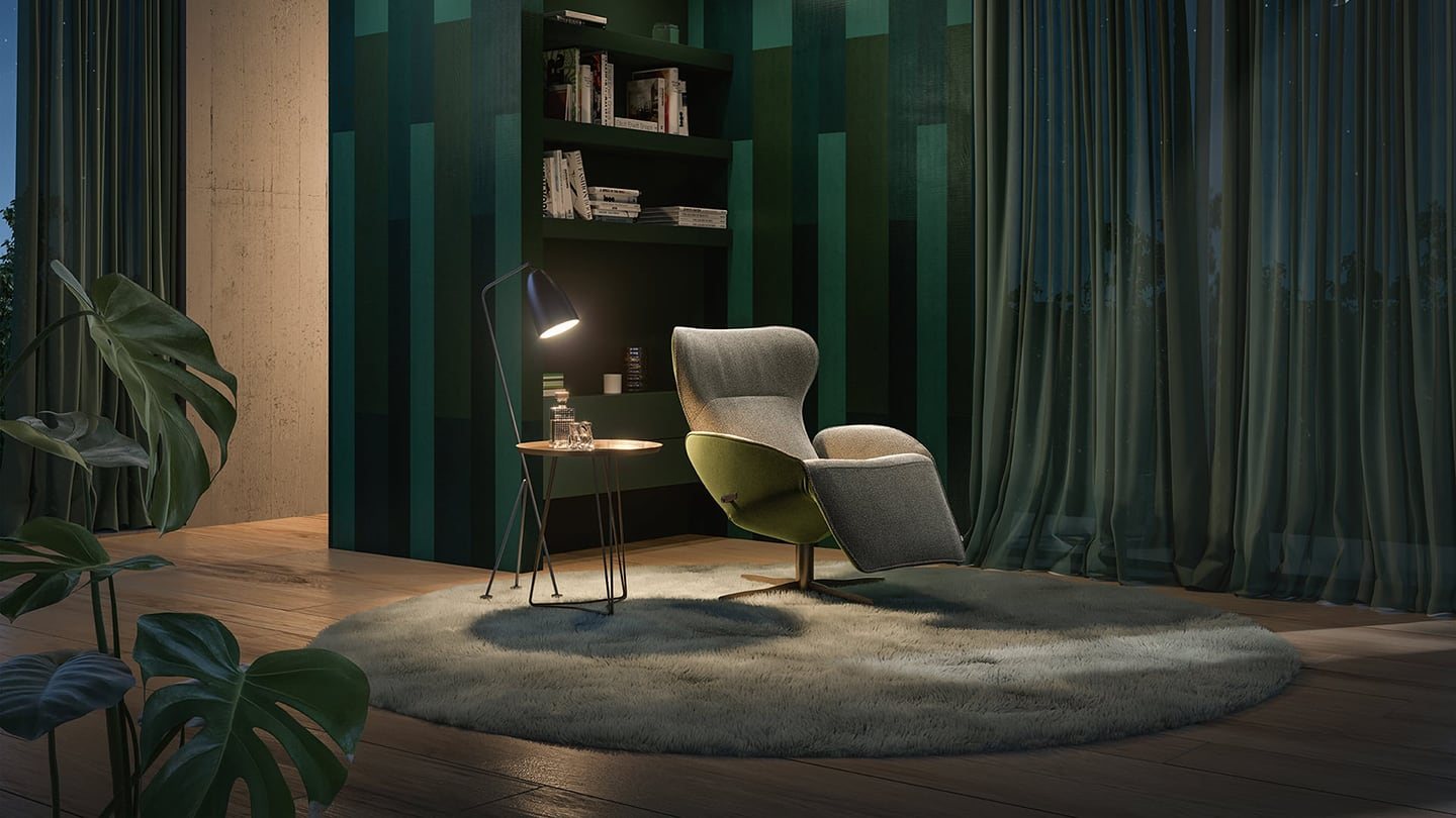 A JORI Daydreamer armchair in a darkened living room